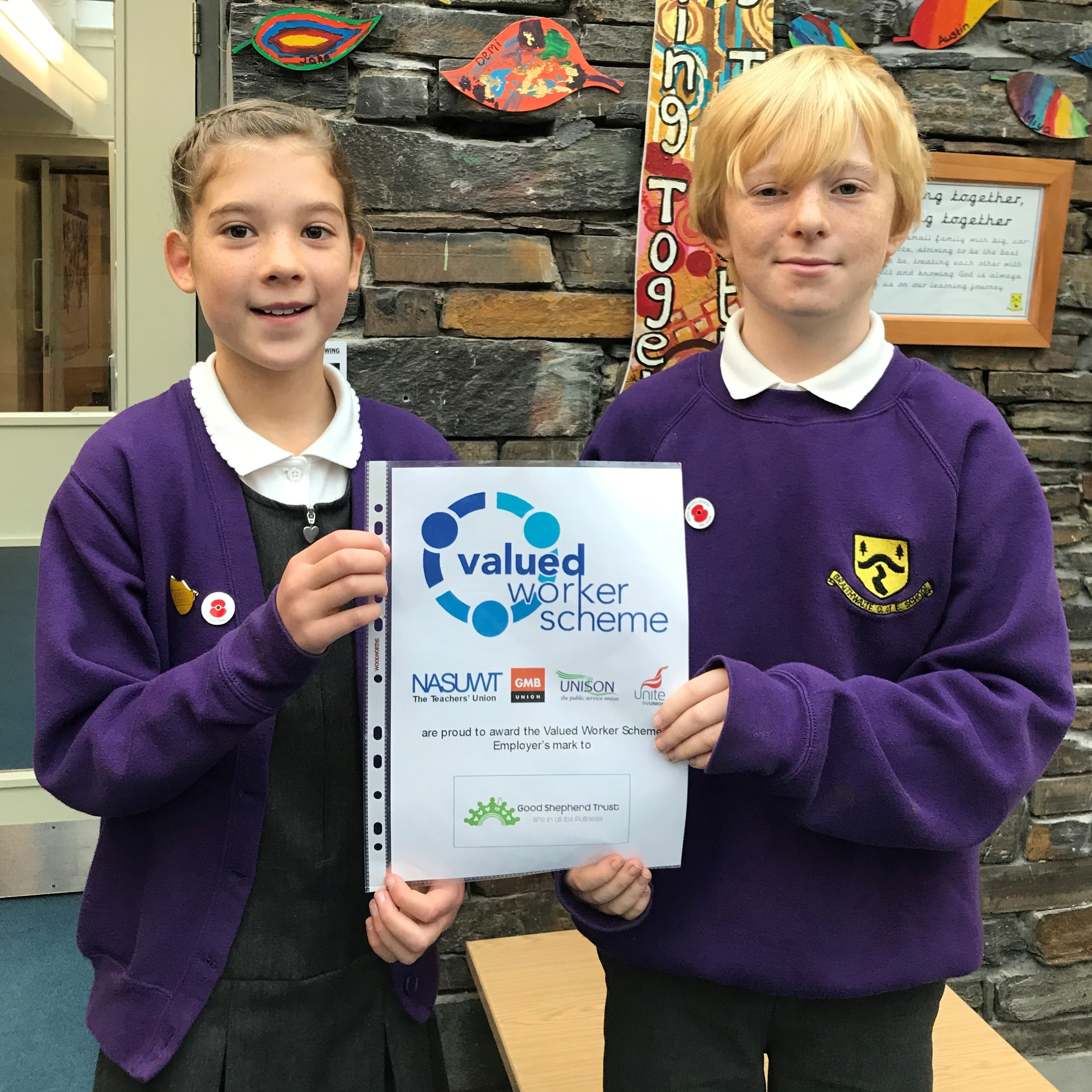 Anna (Y5) and Hughie (Y6) celebrating the Trust's award at Braithwaite CE School